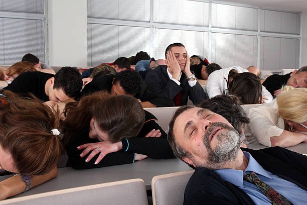 People sleeping at business seminar, only one is still awake. Minilypse Ljubljana 2008